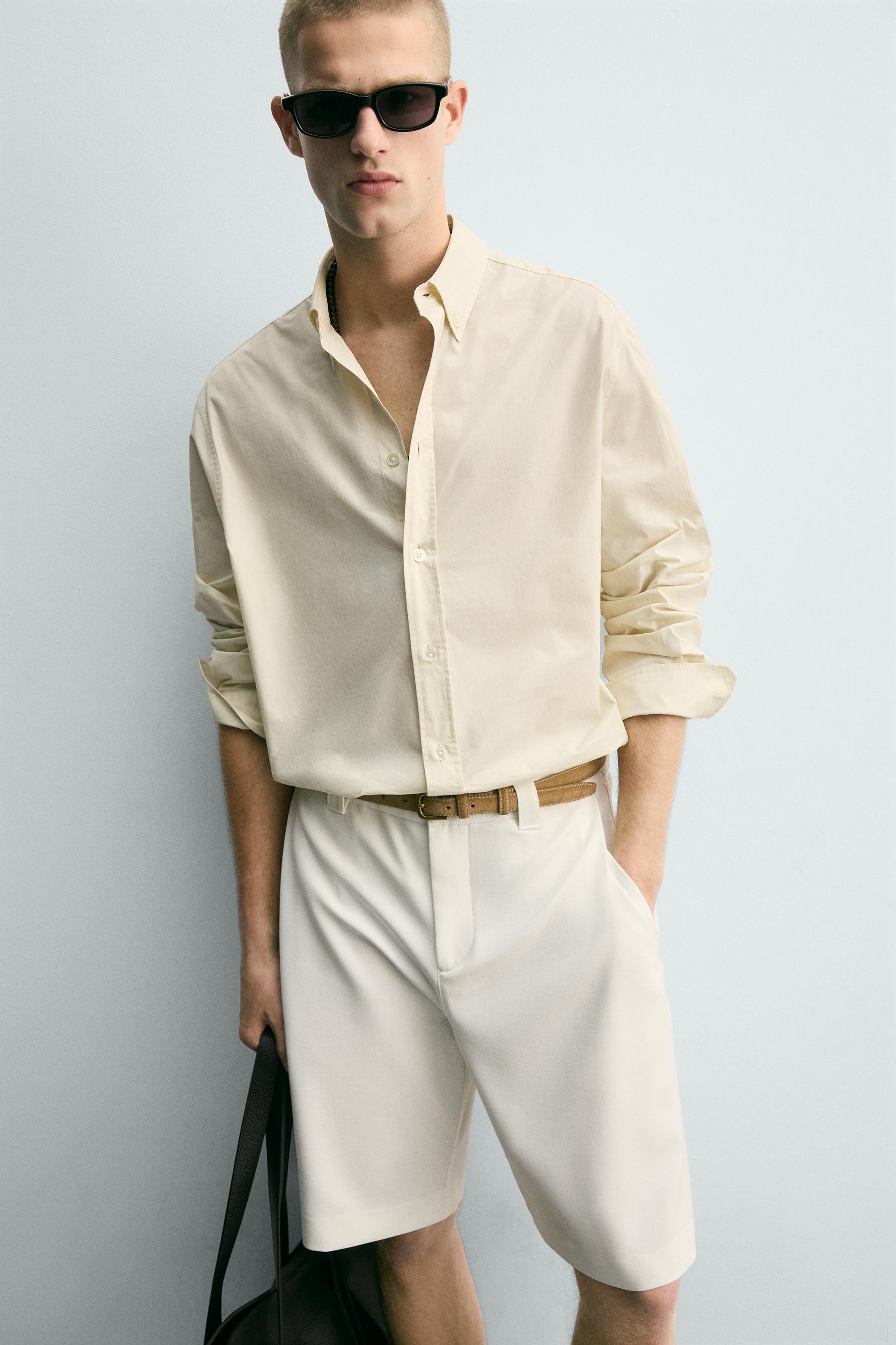 BERMUDA RELAXED FIT PLIS LATÉRAUX